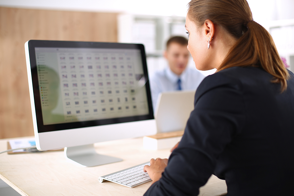 Woman using payroll software