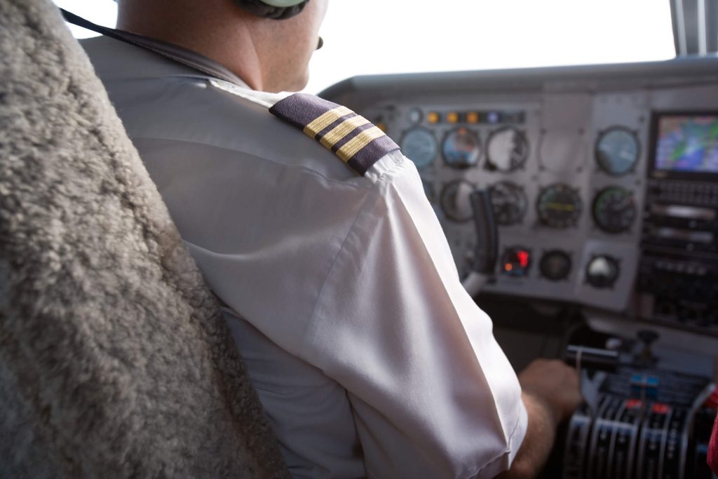 dreamstime_m_1173186 Pilot flying a small airplane